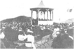 A concert being held at the bandstand at the end of the pier